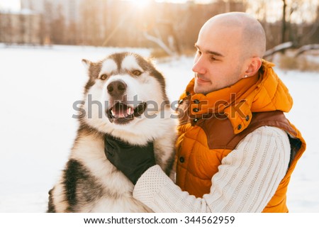 Man walking with dog winter