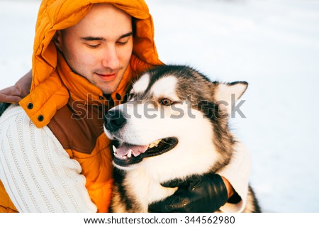 Man walking with dog winter