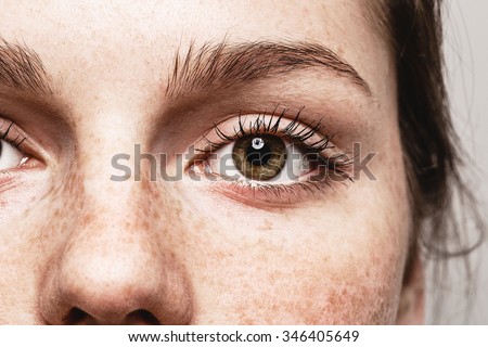 Eyes nose woman Young beautiful freckles woman face portrait with healthy skin