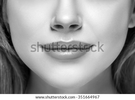 Lips and nose Woman happy young beautiful studio portrait black and white