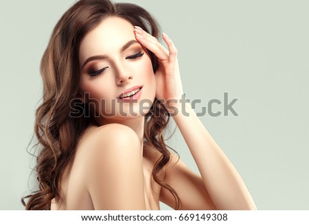 Beautiful Woman Face Portrait Beauty Skin Care Concept. Fashion Beauty Model with beautiful hair and beautiful hands manicure nails