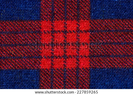 Red and blue flannel fabric texture closeup photo background.