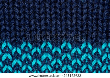 Blue knitting wool with light blue stitches texture background.