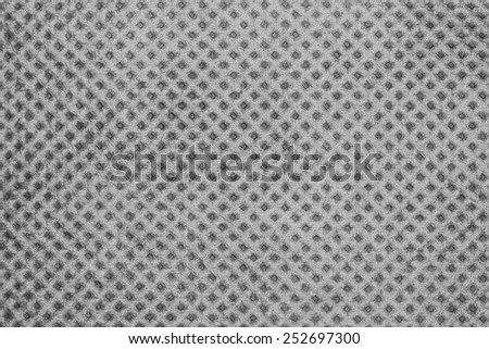 Synthetic fabric with dots pattern texture background.