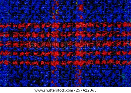 Blue knitting wool with red stripes texture background.