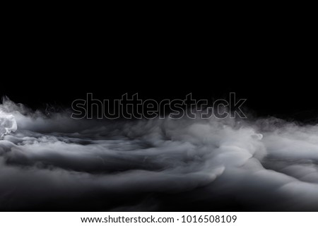 Rolling Billows of Dry Ice fog blowing from the left to the right into clouds