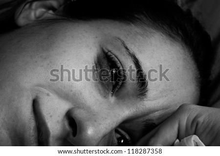 Upset, Crying Woman (Black and white) Sad woman crying with makeup smearing.