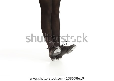 Girl\'s Legs and Feet Posing in Tap Shoes and Black Tights