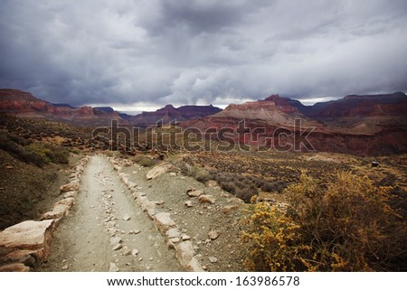 View of the South Kaibab Trail in the Grand Canyon during a Storm. Tip Off rest point is visible in the frame.