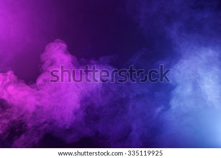 Swirling fog lit with pink and blue gels to create a multicolored background texture.