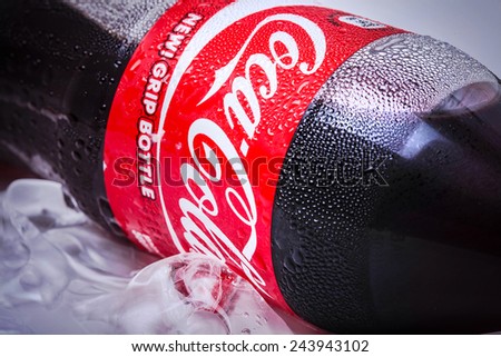 SABAH, MALAYSIA - JANUARY 13, 2015. Bottle of Coca-cola drink isolated on white. The Coca-Cola can, which dates back to 1915, is the most recognised packaging in the world today.