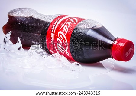 SABAH, MALAYSIA - JANUARY 13, 2015. bottle of Coca-cola drink isolated on white. The Coca-Cola can, which dates back to 1915, is the most recognised packaging in the world today.