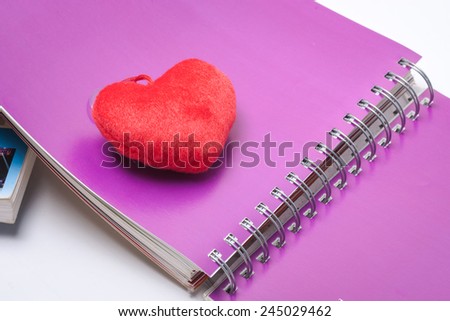 sheet of books with heart icon suitable to the theme of love and education