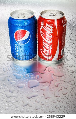 SABAH, MALAYSIA - March 08, 2015: Coca-Cola and Pepsi cans on metal background.