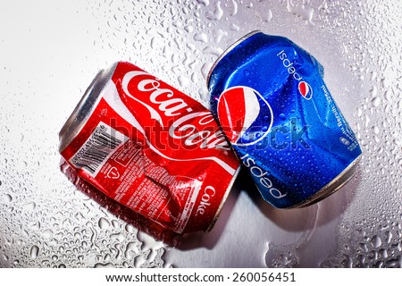SABAH, MALAYSIA - March 11, 2015: Coca-Cola and Pepsi cans on metal background.