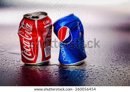 SABAH, MALAYSIA - March 11, 2015: Coca-Cola and Pepsi cans on metal background.