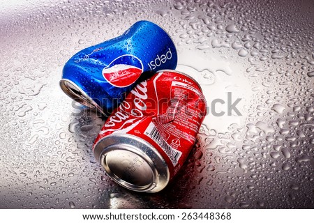 SABAH, MALAYSIA - March 18, 2015: Coca-Cola and Pepsi cans on metal background.
