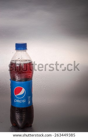 SABAH, MALAYSIA - March 08, 2015: Pepsi bottle on metal background.