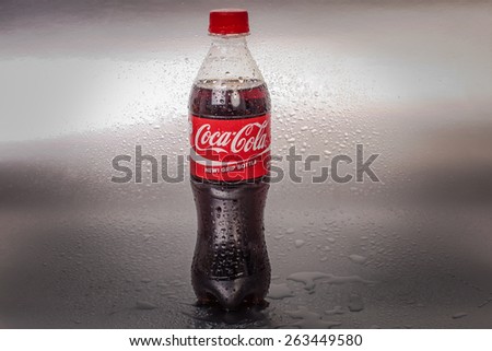 SABAH, MALAYSIA - March 18, 2015: Coca-Cola bottle on metal background.