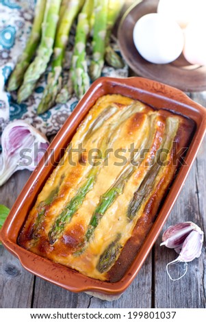 Chicken casserole with omelette and green asparagus