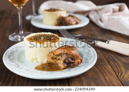 Rabbit under bread sauce with couscous