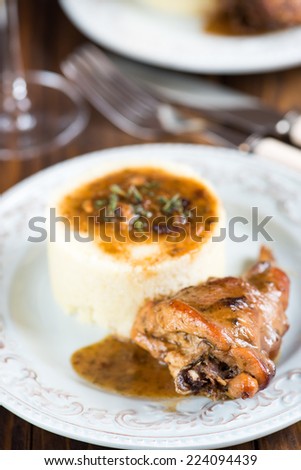 Rabbit under bread sauce with couscous