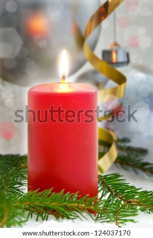 one red single shining candle as dark christmas or advent seasonal background