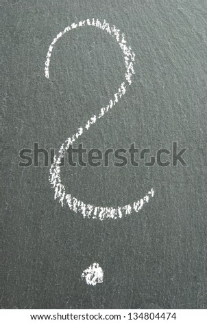 a chalk written question mark on a blackboard