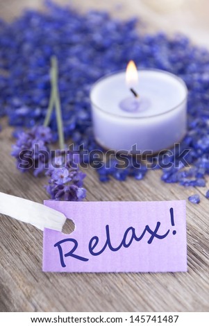 the word relax on a purple label with recreation background