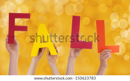 Many Person Holding the Word Fall whit a Yellow Background