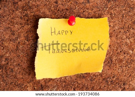 A Yellow Notepad with Happy Thanksgiving on it