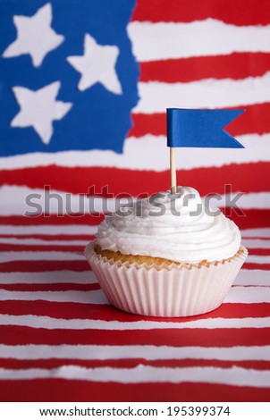 Cupcake with White Topping on an American Flag Background