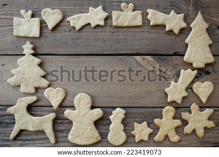 Ginger Breads Building Frame on Wooden Background with Copy Space