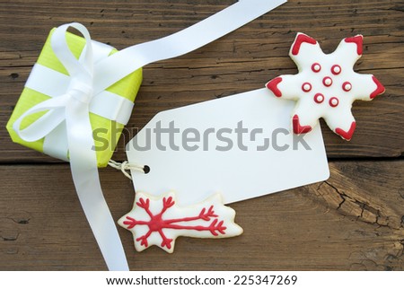 Green Gift and Red and White Decorated Christmas Cookies with an Empty white Label