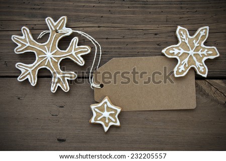 Empty Label with Copy Space decorated with Some Ginger Breads with white Sugar Icing, Christmas or Winter Background