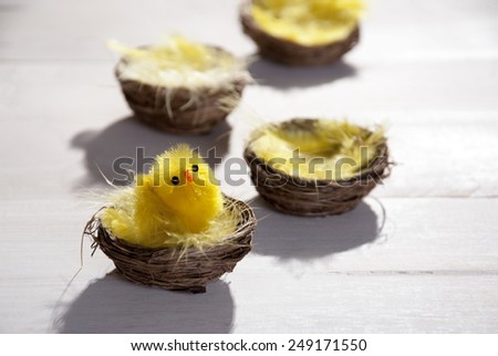Baskets Or Nests With Yellow Feathers And Easter Chick In Sunny Light With Copy Space Free Text Or Your Text Here For Happy Easter Greetings Or Easter Decoration Close Up Or Macro Wooden Background