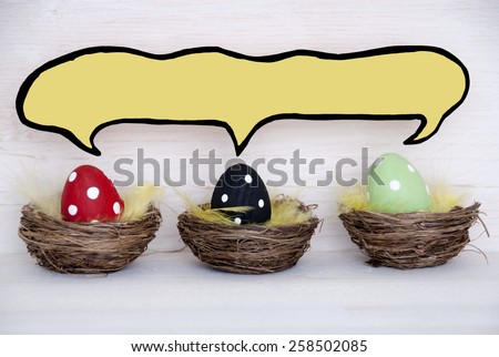 Three Colorful Easter Eggs In Easter Baskets Or Nest On White Wooden Background With Comic Speech Balloon With Copy Space Free Text Or Your Text Here For Advertisement Used As Easter Greetings