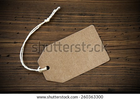 Close Up Of A Brown Label With White Ribbon On Wooden Background For Copy Space Or Free Text Or Your Text Here Frame And Vintage Or Retro Style
