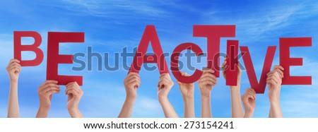 Many Caucasian People And Hands Holding Red Letters Or Characters Building The English Word Be Active On Blue Sky