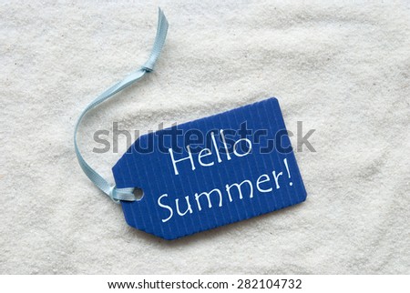 One Blue Label Or Tag With Light Blue Ribbon On White Sand Background With English Text Hello Summer
