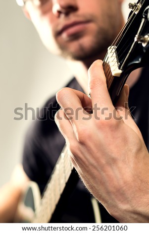 the guy playing on the acoustic guitar