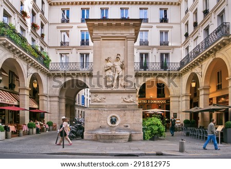 PARIS - September 08: people walk and relax in a cafe near the fountain of Mars in Paris, France on September 08, 2013.  Paris is the most visited city in the world.