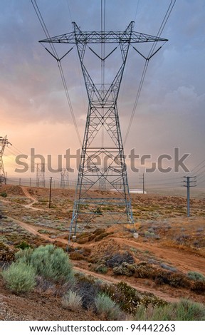 A large power transmission tower and power lines running through the Antelope Valley.