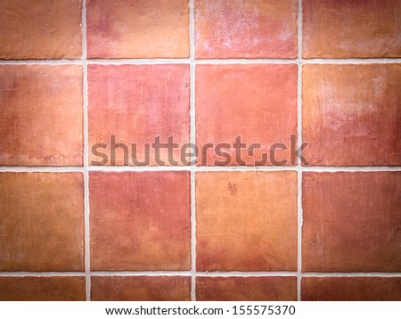 Red stone wall tile with white grout