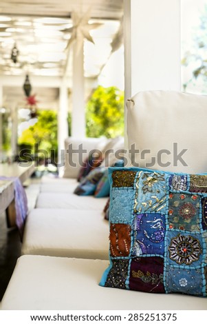 Quilted blue cushion in sofa in outdoor patio