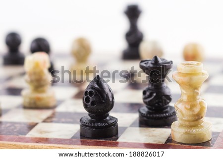 Mate to a white king chess piece by black queen and bishop