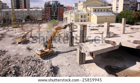 Urban renewal in the city centre. Digger working during dismanling