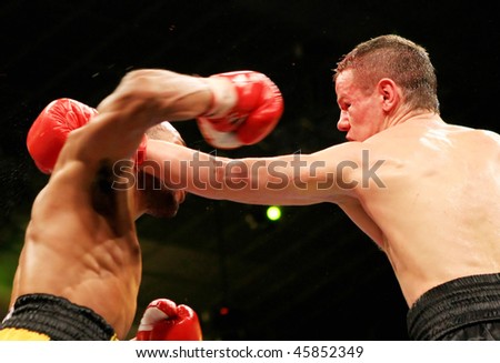 KIEV, UKRAINE - APRIL 19: Yuriy Nuzhnenko of Ukraine (R) throws a punch against Irving Garcia of Puerto Rico during their WBA World Welterweight Title fight on April 19, 2008 in Kiev, Ukraine