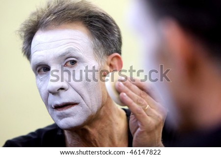 KYIV, UKRAINE - MARCH 11: Ukrainian mime Oleh Yemtsev puts his makeup on getting ready for his show called \