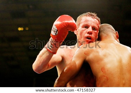 KIEV, UKRAINE - APRIL 19: WBA welterweight belt holder Yuriy Nuzhnenko throws a punch against Irving Garcia during their WBA World Welterweight Title fight on April 19, 2008 in Kyiv, Ukraine
